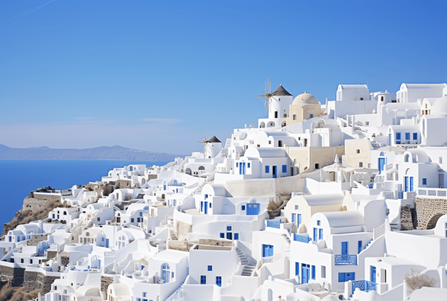 Santorini's whitewashed buildings and blue domes above the Aegean Sea